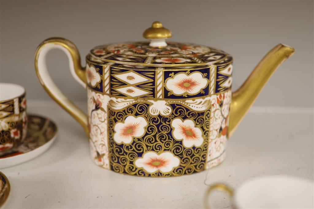 Six Royal Crown Derby coffee cups and saucers and teapot and stand